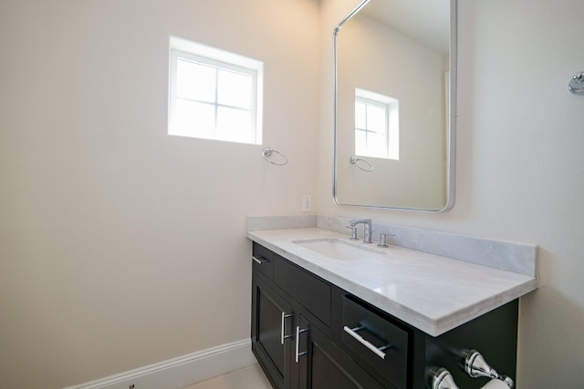 8682 Green Kolbe Ln, Houston, TX 77080 - bathroom featuring vanity and baseboards