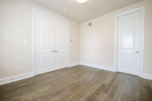 8682 Green Kolbe Ln, Houston, TX 77080 - unfurnished bedroom featuring wood finished floors and a closet