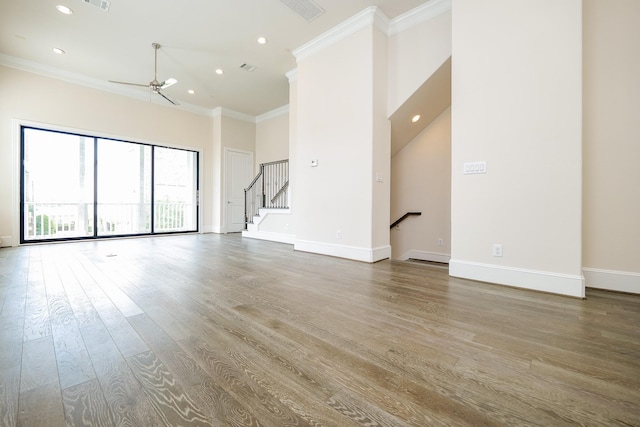 8682 Green Kolbe Ln, Houston, TX 77080 - unfurnished living room with crown molding, recessed lighting, wood finished floors, stairs, and a ceiling fan