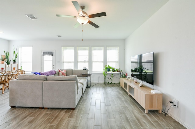 4437 Jessamine Creek Trl, Rosharon, TX 77583 - living room with light wood-style flooring, plenty of natural light, and ceiling fan