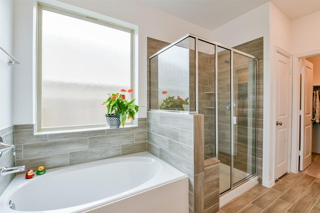 4437 Jessamine Creek Trl, Rosharon, TX 77583 - full bath with a bath, a stall shower, and wood tiled floors