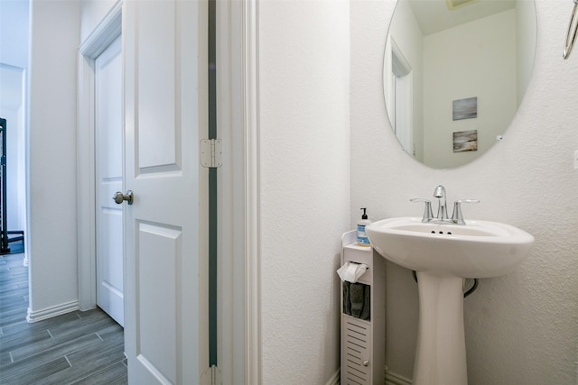 4437 Jessamine Creek Trl, Rosharon, TX 77583 - bathroom featuring wood finished floors and a sink