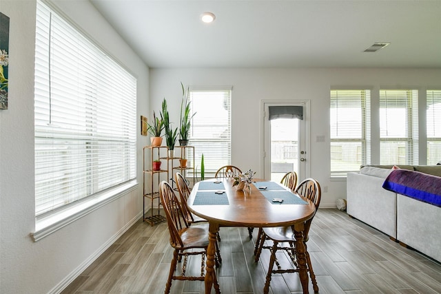 4437 Jessamine Creek Trl, Rosharon, TX 77583 - dining area with wood tiled floors, plenty of natural light, and recessed lighting
