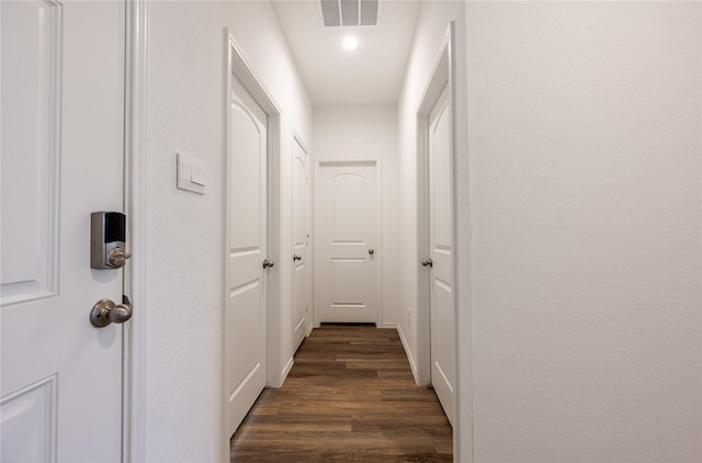 21427 Hawthorn Prairie Dr, New Caney, TX 77357 - corridor with dark wood-style floors