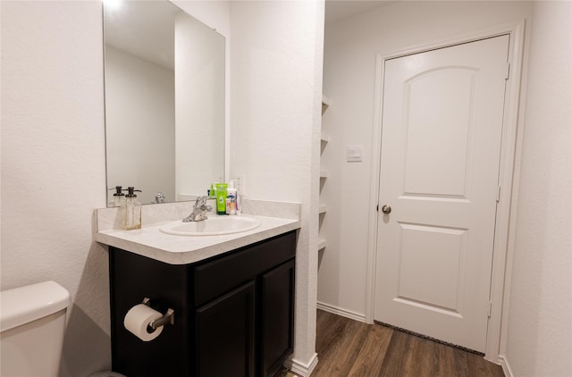 21427 Hawthorn Prairie Dr, New Caney, TX 77357 - bathroom with wood finished floors and vanity