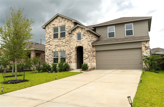 21427 Hawthorn Prairie Dr, New Caney, TX 77357 - view of front of property featuring a garage, concrete driveway, a front lawn, stone siding, and roof with shingles