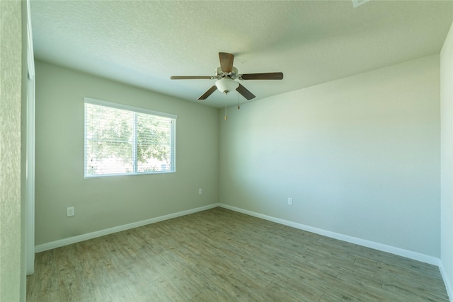10126 Relic Oaks, San Antonio, TX 78240 - spare room featuring wood finished floors, a ceiling fan, and a textured ceiling