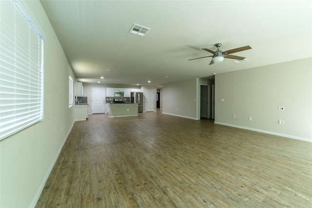 10126 Relic Oaks, San Antonio, TX 78240 - unfurnished living room featuring wood finished floors, ceiling fan, and recessed lighting