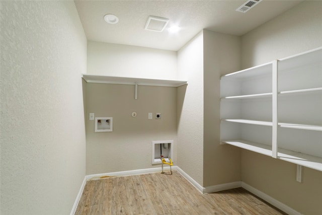 10126 Relic Oaks, San Antonio, TX 78240 - washroom featuring electric dryer hookup, wood finished floors, hookup for a gas dryer, and washer hookup