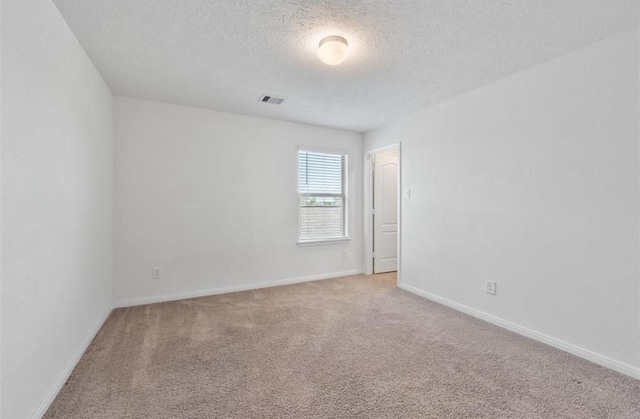 2019 Damasi Ln, Fresno, TX 77545 - spare room with light carpet and a textured ceiling