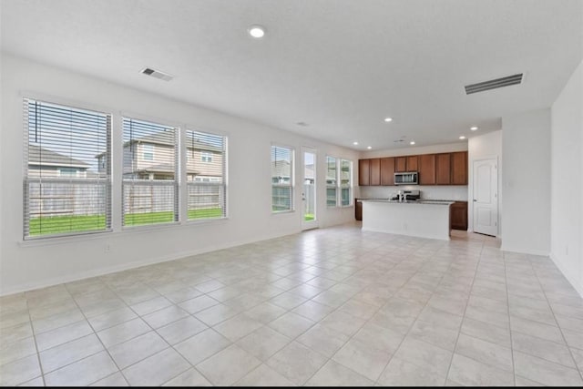 2019 Damasi Ln, Fresno, TX 77545 - unfurnished living room with recessed lighting and light tile patterned floors