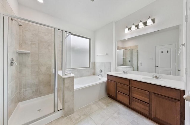 2019 Damasi Ln, Fresno, TX 77545 - full bathroom with a garden tub, a shower stall, double vanity, and tile patterned flooring