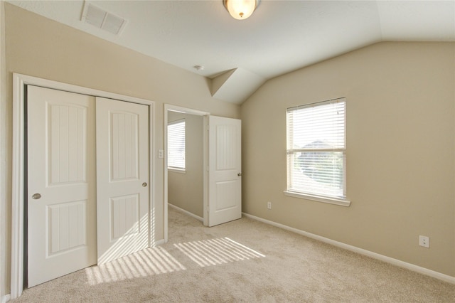 8115 Heartbrook Field Ln, Cypress, TX 77433 - unfurnished bedroom with multiple windows, lofted ceiling, carpet flooring, and a closet
