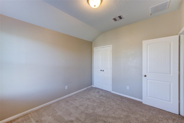 8115 Heartbrook Field Ln, Cypress, TX 77433 - unfurnished bedroom featuring carpet floors, vaulted ceiling, and a closet