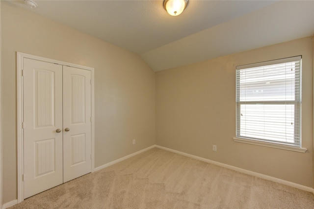 8115 Heartbrook Field Ln, Cypress, TX 77433 - unfurnished bedroom with carpet flooring, a closet, and lofted ceiling