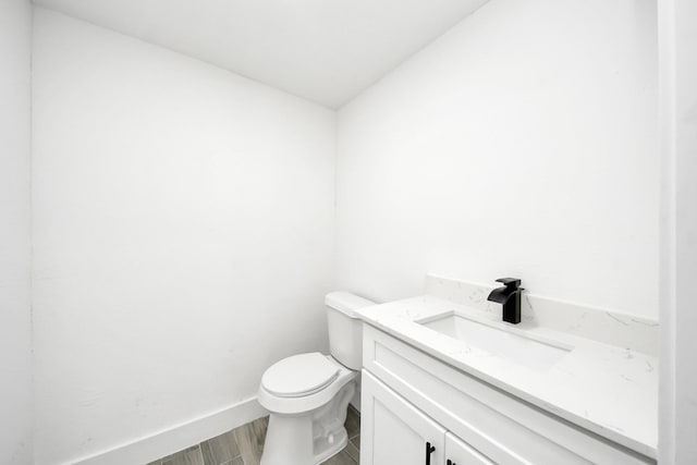 7208 Helmers St, Houston, TX 77022 - half bath featuring vanity and wood finished floors