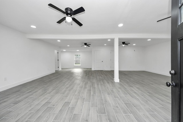 7208 Helmers St, Houston, TX 77022 - unfurnished living room with recessed lighting, light wood-type flooring, and ceiling fan