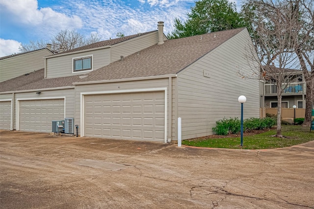 2379 Briarwest Blvd Unit 46, Houston, TX 77077 - garage featuring concrete driveway