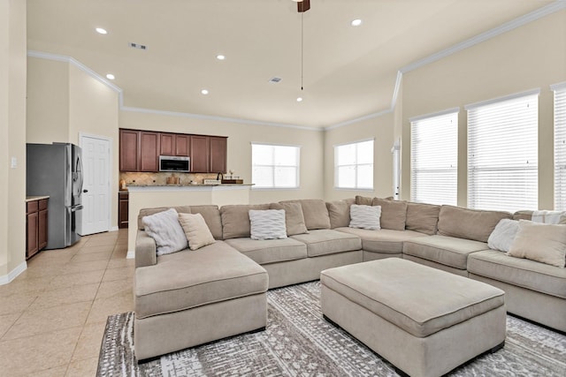 26642 Becker Pines Ln, Katy, TX 77494 - living room with crown molding, light tile patterned floors, recessed lighting, and a ceiling fan