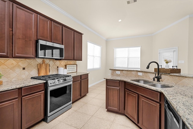 26642 Becker Pines Ln, Katy, TX 77494 - kitchen featuring stainless steel appliances, tasteful backsplash, crown molding, light tile patterned floors, and light stone counters