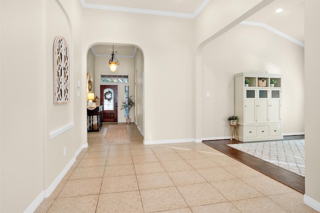 26642 Becker Pines Ln, Katy, TX 77494 - tiled entrance foyer with arched walkways, ornamental molding, and recessed lighting