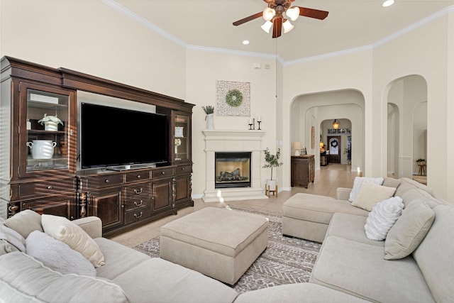 26642 Becker Pines Ln, Katy, TX 77494 - living area with arched walkways, ceiling fan, crown molding, recessed lighting, and light tile patterned floors