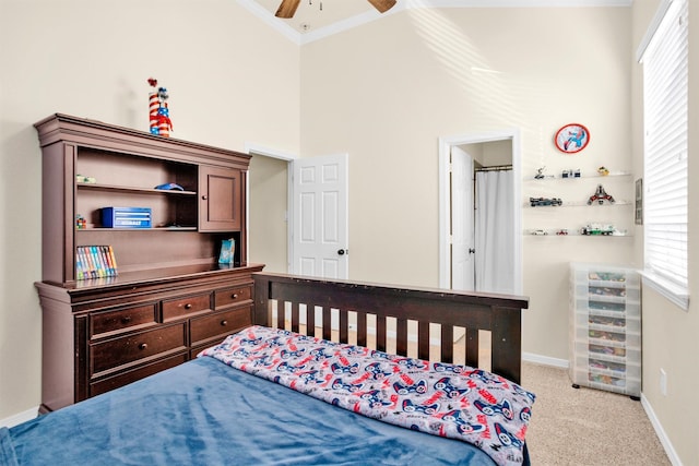 26642 Becker Pines Ln, Katy, TX 77494 - bedroom with multiple windows, crown molding, carpet flooring, and a towering ceiling