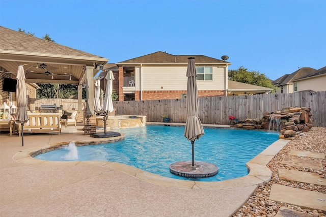 26642 Becker Pines Ln, Katy, TX 77494 - view of swimming pool with a fenced backyard, a patio, ceiling fan, and a pool with connected hot tub