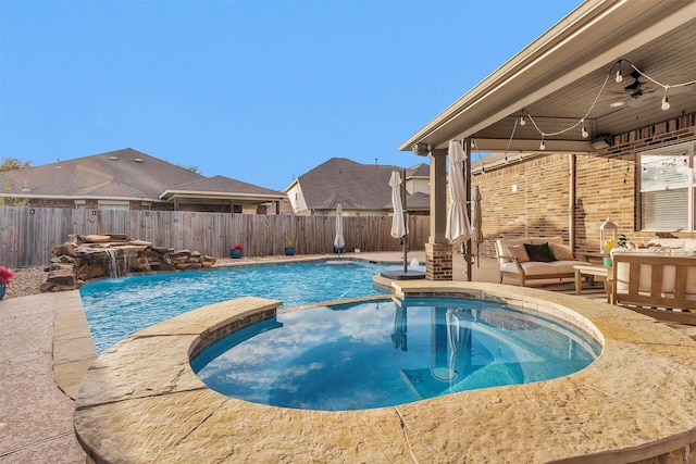 26642 Becker Pines Ln, Katy, TX 77494 - view of pool with a pool with connected hot tub, a fenced backyard, ceiling fan, and an outdoor living space