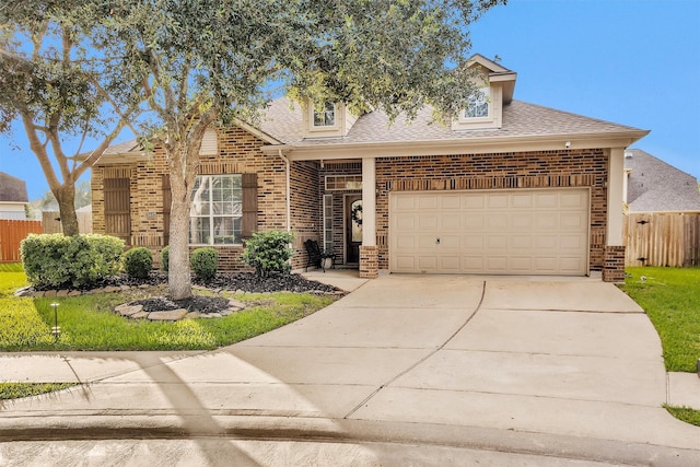26642 Becker Pines Ln, Katy, TX 77494 - traditional-style house with brick siding, roof with shingles, and driveway