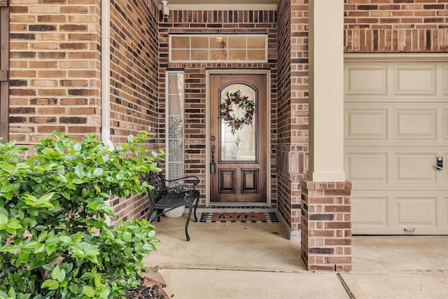 26642 Becker Pines Ln, Katy, TX 77494 - property entrance featuring brick siding, concrete driveway, and an attached garage