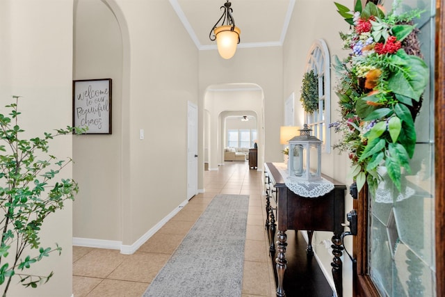26642 Becker Pines Ln, Katy, TX 77494 - hall with arched walkways, light tile patterned flooring, a high ceiling, and ornamental molding