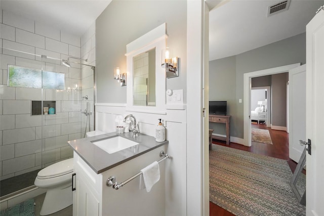 3815 Avenue N 1/2 Ave N 1/2, Galveston, TX 77550 - ensuite bathroom with a shower stall, vanity, and wood finished floors