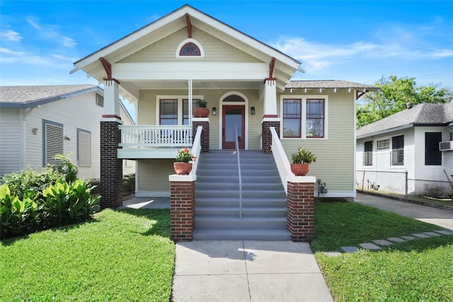 3815 Avenue N 1/2 Ave N 1/2, Galveston, TX 77550 - view of front of home featuring covered porch and a front yard