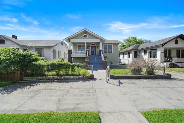 3815 Avenue N 1/2 Ave N 1/2, Galveston, TX 77550 - view of front facade with a porch, a fenced front yard, and stairs