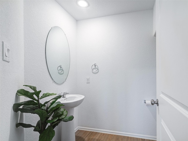 114 Austin Rd, Angleton, TX 77515 - bathroom with wood finished floors and baseboards