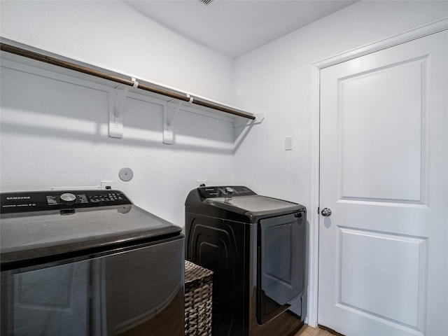 114 Austin Rd, Angleton, TX 77515 - laundry room featuring separate washer and dryer and light wood-style floors