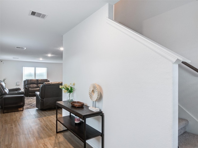 114 Austin Rd, Angleton, TX 77515 - hall featuring stairs, wood finished floors, and recessed lighting
