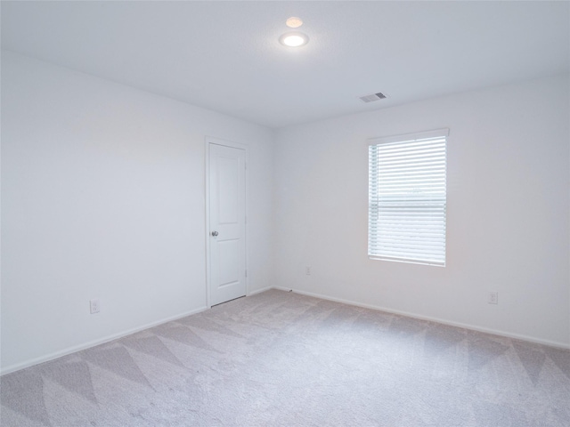 114 Austin Rd, Angleton, TX 77515 - spare room featuring light carpet and baseboards