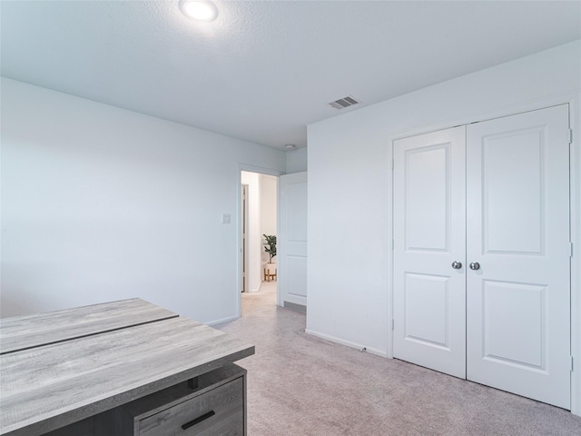 114 Austin Rd, Angleton, TX 77515 - unfurnished bedroom featuring light colored carpet and a closet