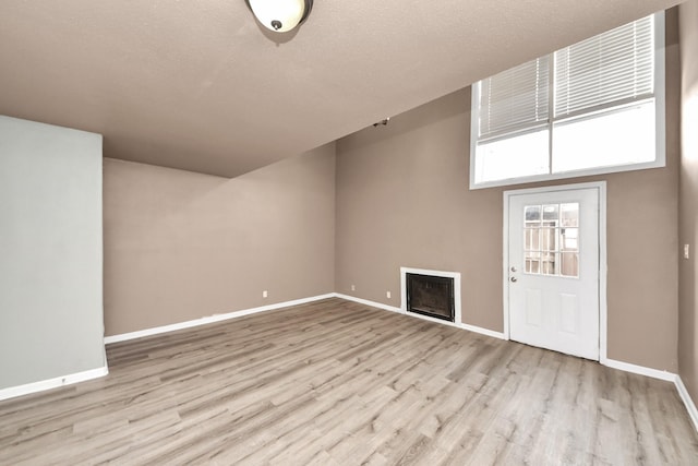 11877 Algonquin Dr, Houston, TX 77089 - unfurnished living room featuring a fireplace and wood finished floors