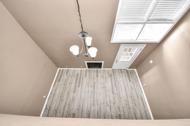 11877 Algonquin Dr, Houston, TX 77089 - unfurnished living room with wood finished floors and a chandelier
