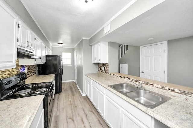 11877 Algonquin Dr, Houston, TX 77089 - kitchen featuring electric range, under cabinet range hood, light countertops, white cabinetry, and ornamental molding