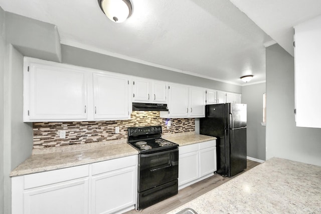 11877 Algonquin Dr, Houston, TX 77089 - kitchen featuring black appliances, light wood finished floors, under cabinet range hood, white cabinets, and crown molding