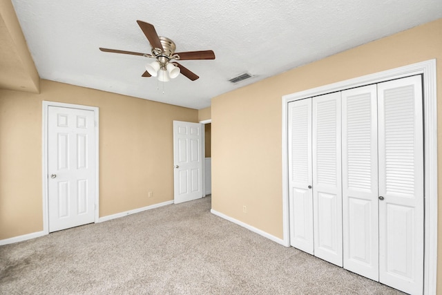 11877 Algonquin Dr, Houston, TX 77089 - unfurnished bedroom featuring carpet floors, a closet, a textured ceiling, and ceiling fan