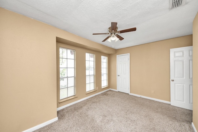 11877 Algonquin Dr, Houston, TX 77089 - carpeted empty room featuring ceiling fan and a textured ceiling