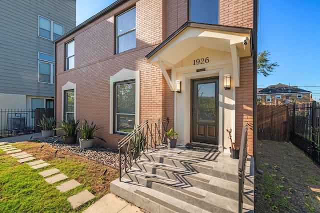 1926 Blodgett St, Houston, TX 77004 - view of exterior entry featuring brick siding and a surveillance system
