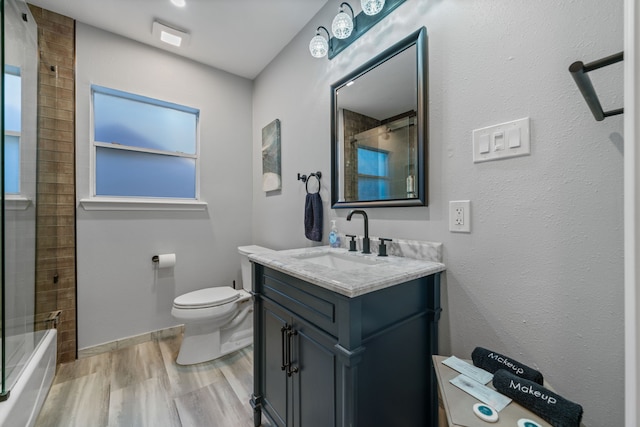 1926 Blodgett St, Houston, TX 77004 - full bathroom featuring vanity, wood finished floors, bathing tub / shower combination, and healthy amount of natural light