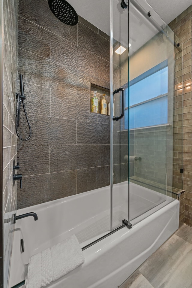 1926 Blodgett St, Houston, TX 77004 - bathroom with a combined bath / shower with rainfall shower and wood finished floors