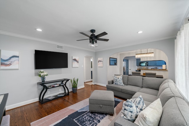 1926 Blodgett St, Houston, TX 77004 - living area with arched walkways, wood finished floors, ceiling fan, recessed lighting, and ornamental molding
